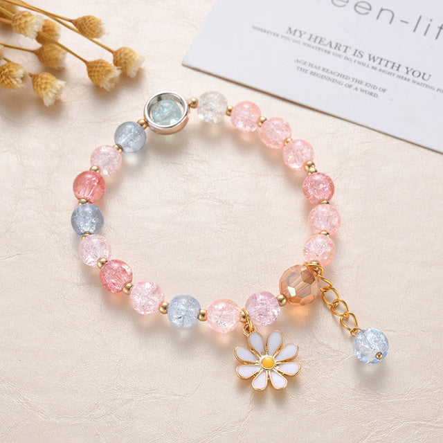 Roze en Blauwe Stenen en Margriet Bloem Armband in Goud