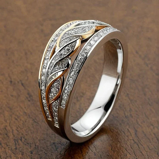 Holle, glanzende, gevlochten gouden en zilveren ring