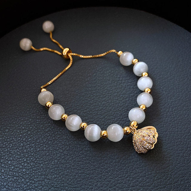 Schelp Armband met Parel in Goud